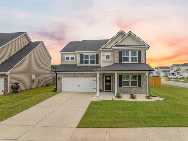 701 Squire Pope Rd, Summerville, SC 29486 - craftsman-style house with brick siding, a front lawn, driveway, board and batten siding, and a garage
