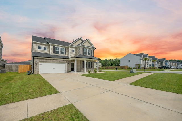 701 Squire Pope Rd, Summerville, SC 29486 - view of front of house featuring an attached garage, covered porch, driveway, and brick siding
