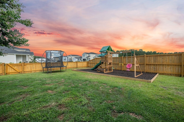 701 Squire Pope Rd, Summerville, SC 29486 - yard at dusk featuring a trampoline, a playground, a fenced backyard, and a residential view