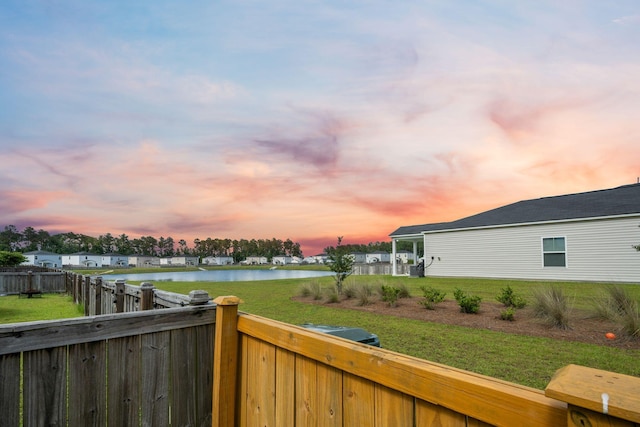 701 Squire Pope Rd, Summerville, SC 29486 - yard at dusk with a water view and a fenced backyard