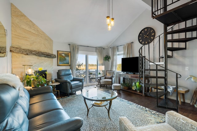 living room featuring dark hardwood / wood-style flooring and high vaulted ceiling