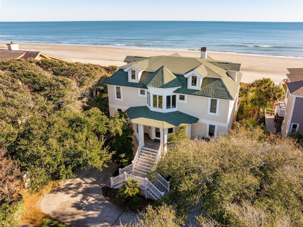 bird's eye view featuring a view of the beach and a water view