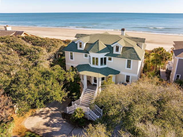 bird's eye view featuring a view of the beach and a water view