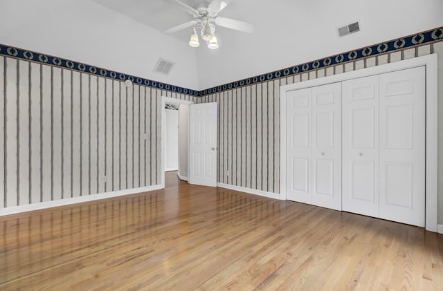 unfurnished bedroom featuring ceiling fan, a closet, and light hardwood / wood-style floors