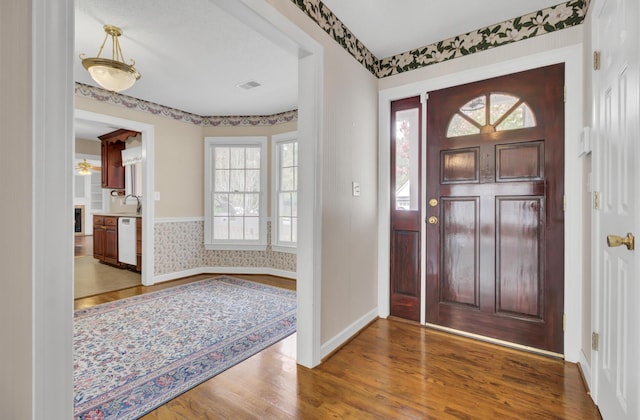 entrance foyer featuring hardwood / wood-style flooring and sink