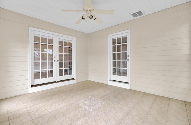 interior space featuring ceiling fan and french doors