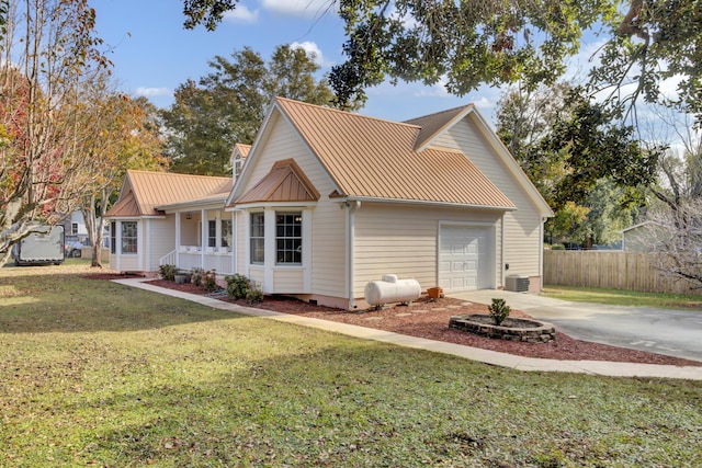 view of front of property featuring a garage and a front yard