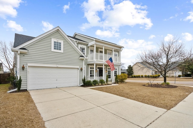 view of front facade featuring a garage, a balcony, and a porch