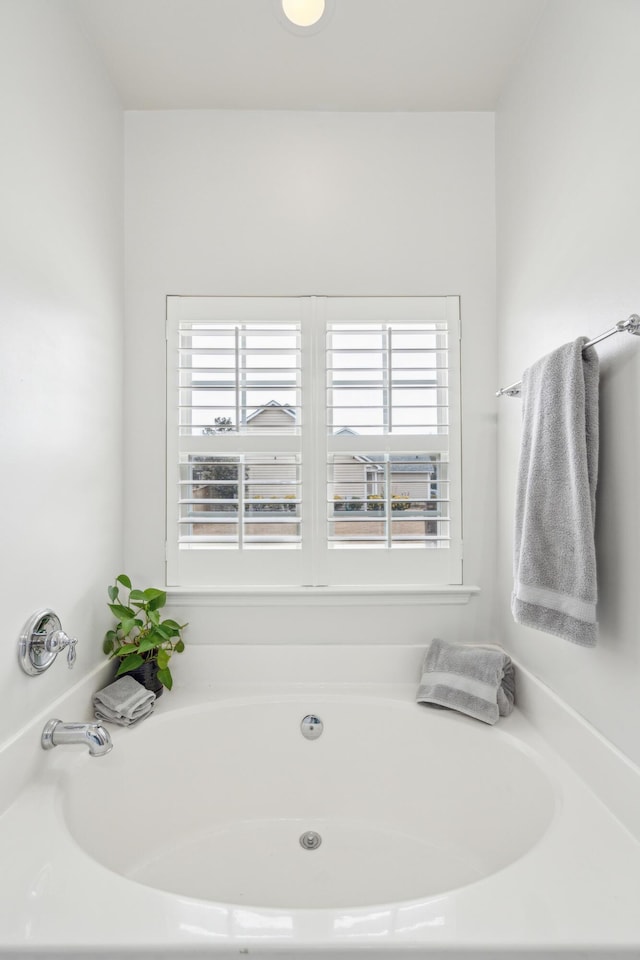 bathroom featuring a tub