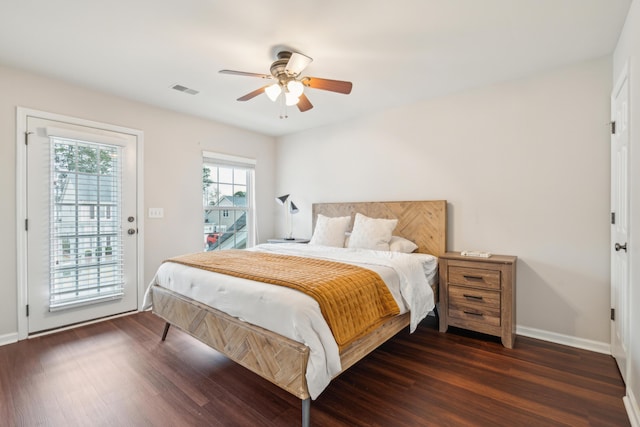 bedroom with dark hardwood / wood-style floors, access to outside, and ceiling fan