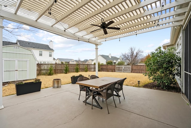 view of patio / terrace with a storage unit and a pergola