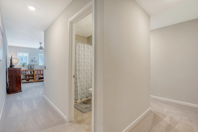 hallway with carpet, baseboards, and recessed lighting