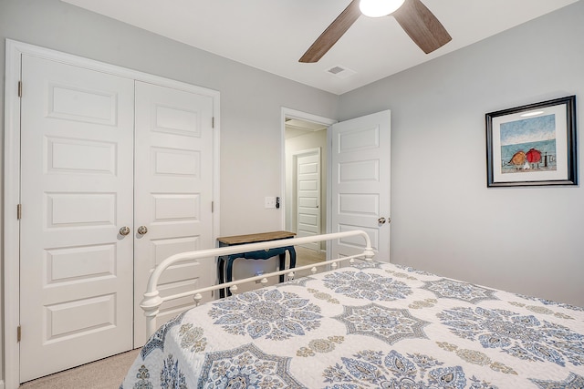 bedroom featuring visible vents, a closet, and a ceiling fan