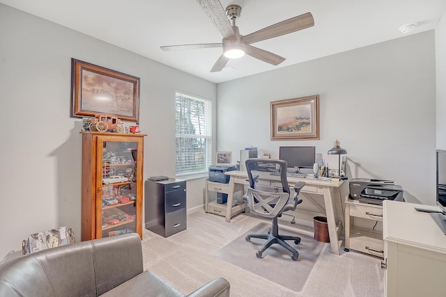 office with a ceiling fan and light colored carpet