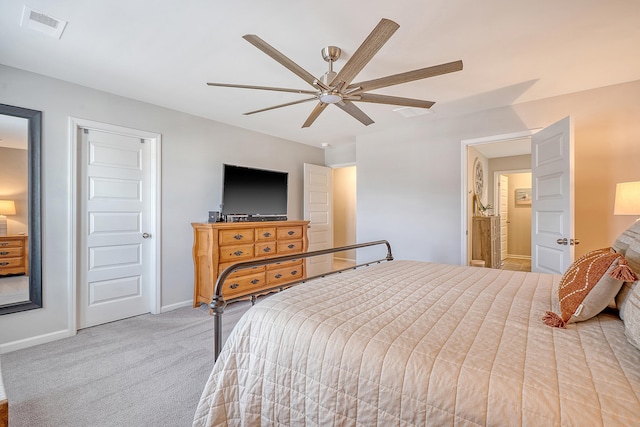 carpeted bedroom with ceiling fan, visible vents, and baseboards