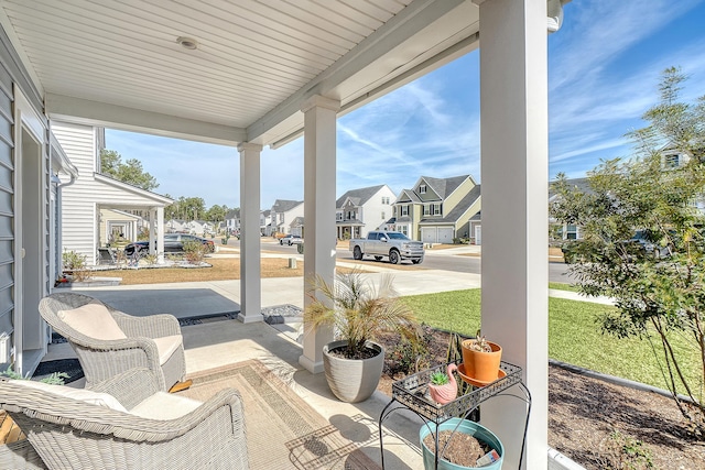 view of patio / terrace featuring covered porch and a residential view