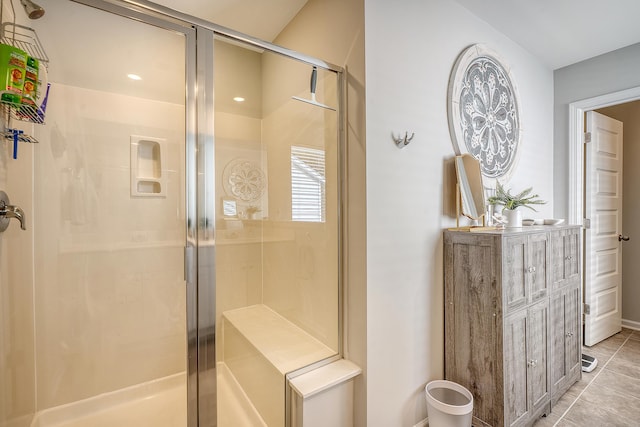 full bath with a stall shower and tile patterned floors