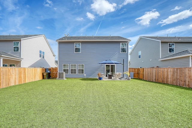 rear view of house with a patio area, a lawn, a fenced backyard, and central air condition unit