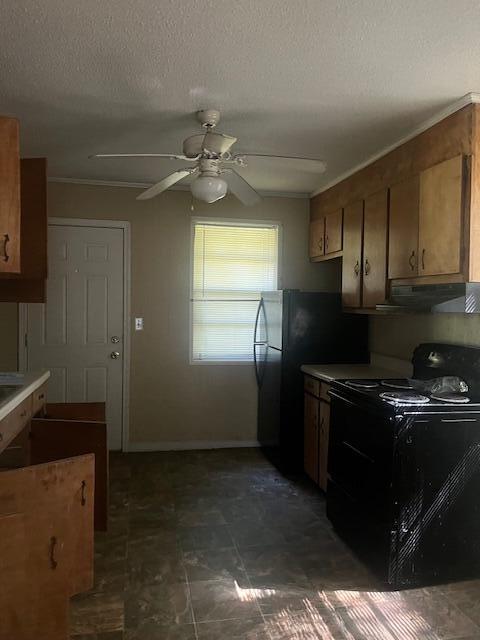 kitchen featuring ceiling fan, a textured ceiling, and black appliances