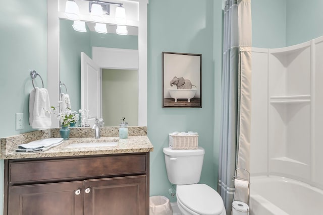 bathroom with vanity, shower / tub combo, and toilet