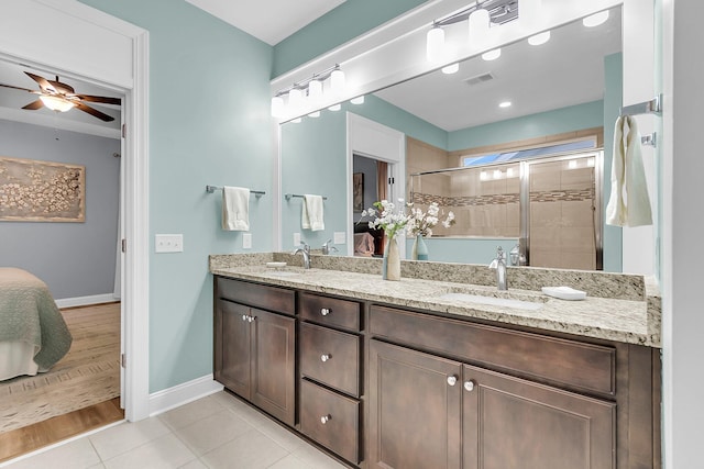 ensuite bathroom featuring visible vents, a sink, ensuite bath, a shower stall, and tile patterned flooring