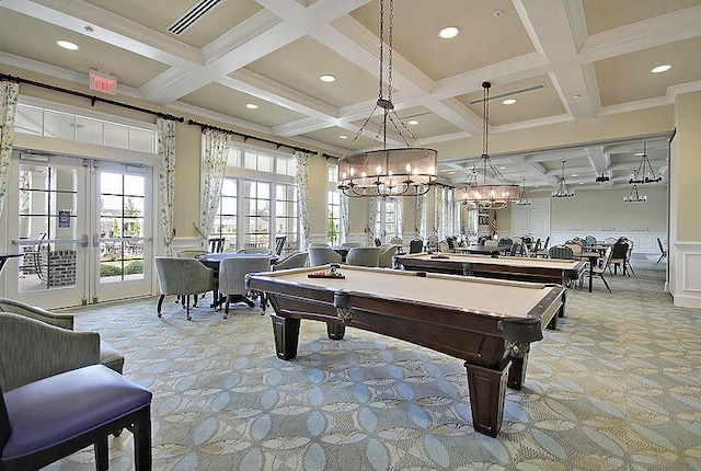 playroom featuring coffered ceiling, french doors, wainscoting, beamed ceiling, and a decorative wall