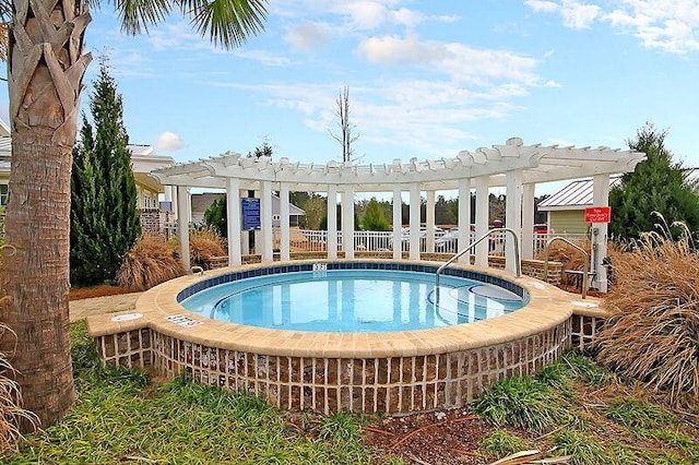 view of pool featuring fence, a pergola, and a hot tub