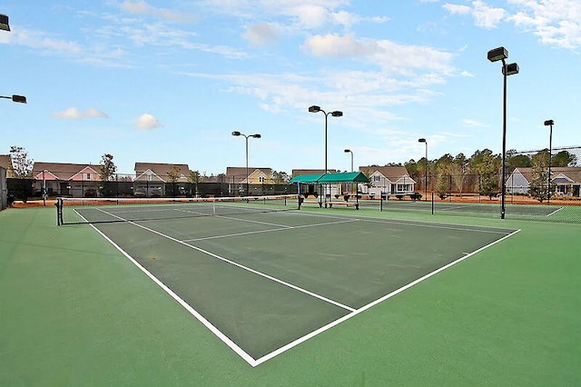 view of tennis court with fence