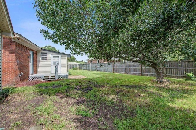 view of yard with a fenced backyard