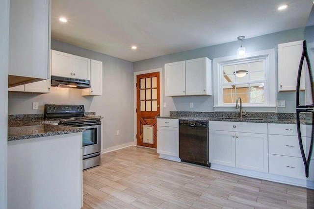 kitchen with white cabinets, a sink, under cabinet range hood, and black appliances