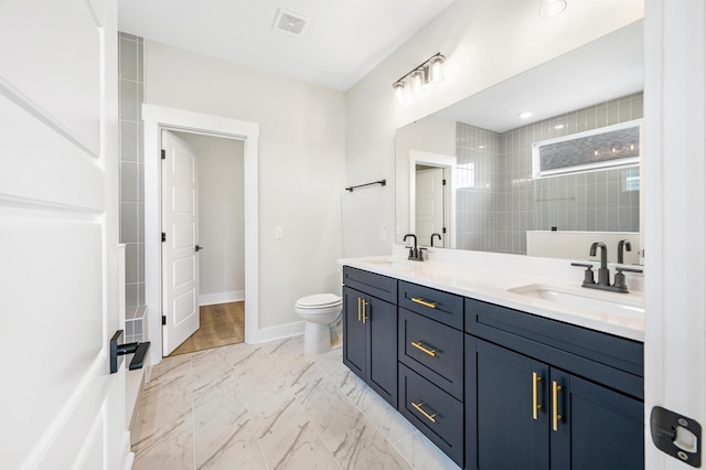 1350 Lucinda St, Mount Pleasant, SC 29466 - full bathroom with double vanity, marble look tiles, toilet, walk in shower, and baseboards