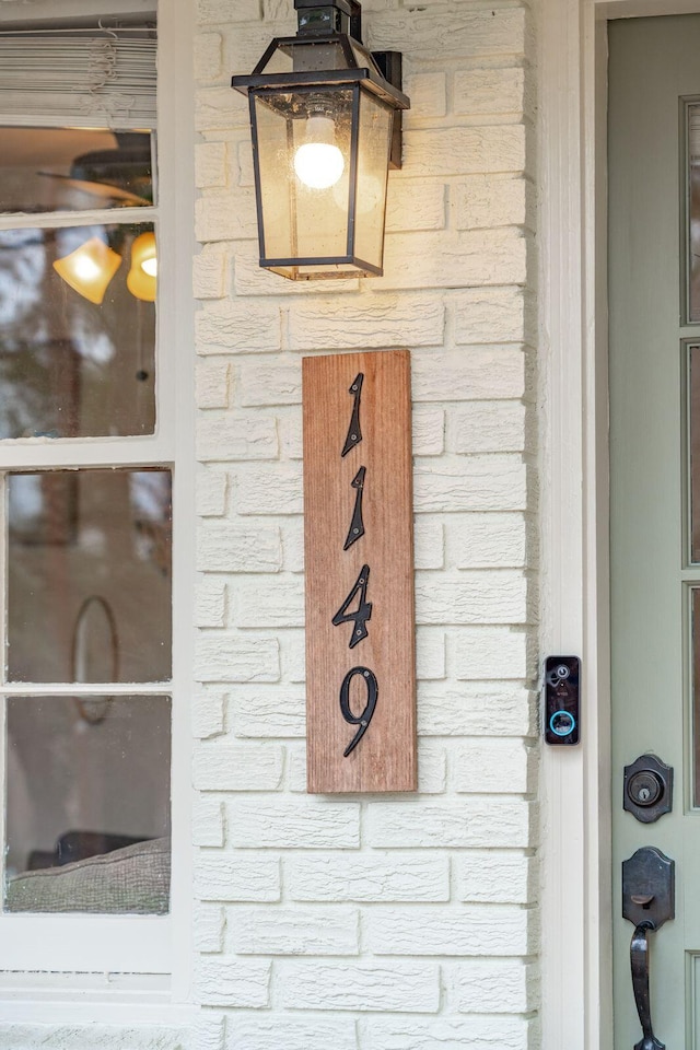 details featuring stone siding and brick siding