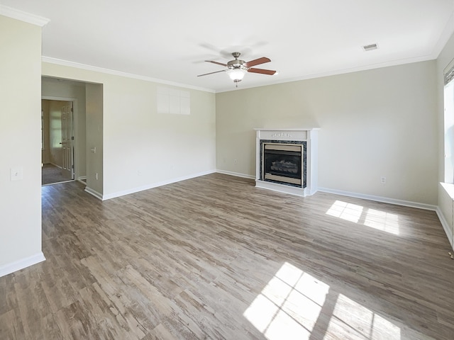 unfurnished living room featuring crown molding, hardwood / wood-style floors, and ceiling fan