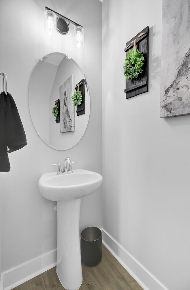 bathroom with hardwood / wood-style floors