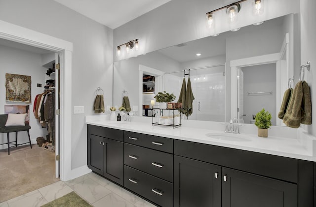 bathroom featuring vanity and an enclosed shower