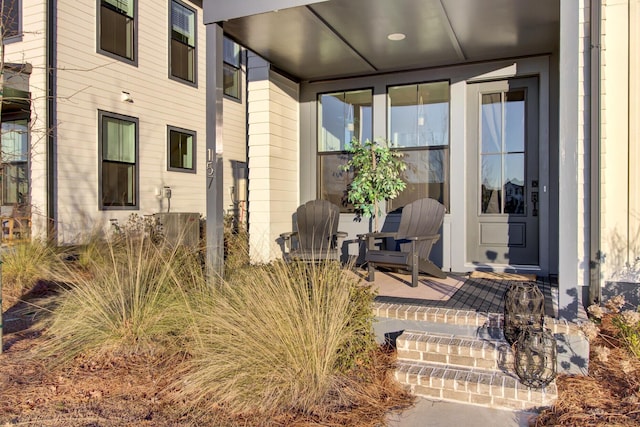 entrance to property featuring central air condition unit