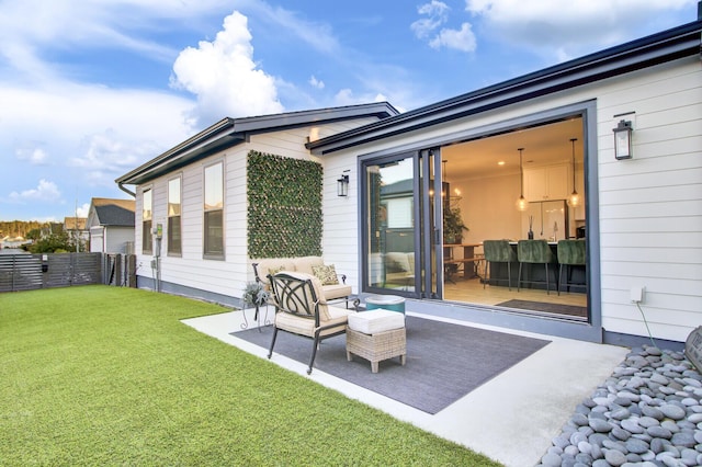 rear view of house featuring a yard and a patio area