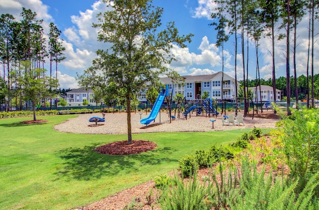 view of jungle gym featuring a lawn