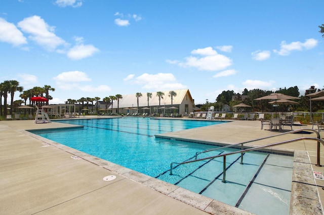 view of swimming pool featuring a patio area