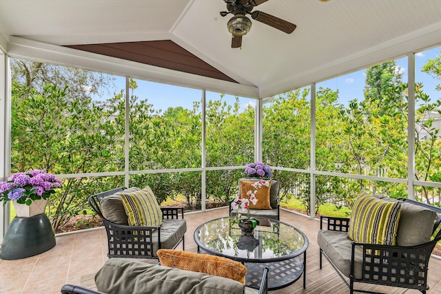 sunroom / solarium featuring a ceiling fan, vaulted ceiling, and an outdoor hangout area