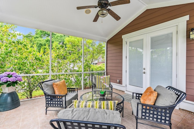 sunroom / solarium featuring vaulted ceiling, ceiling fan, and outdoor dining space