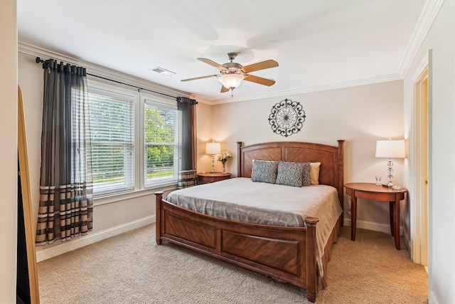 bedroom with baseboards, light colored carpet, crown molding, and ceiling fan