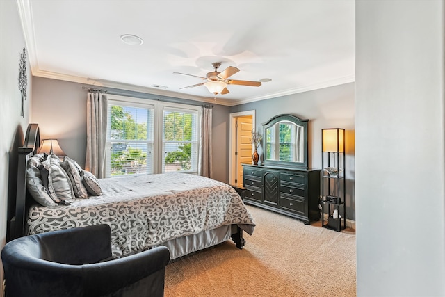 bedroom with ornamental molding, multiple windows, light colored carpet, a ceiling fan, and baseboards