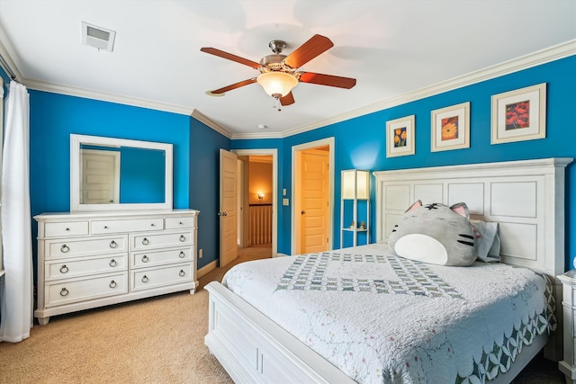 bedroom featuring ornamental molding, light carpet, a ceiling fan, and baseboards