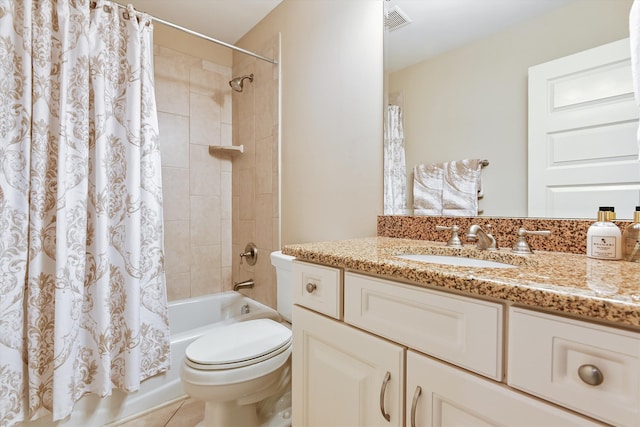 full bath featuring toilet, shower / bath combo with shower curtain, vanity, and tile patterned flooring