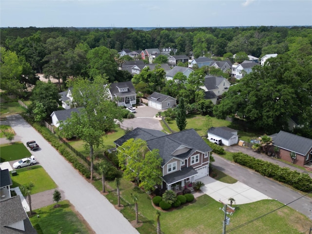 aerial perspective of suburban area featuring a forest