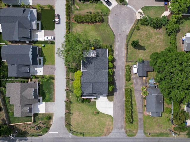 aerial view of property and surrounding area featuring nearby suburban area