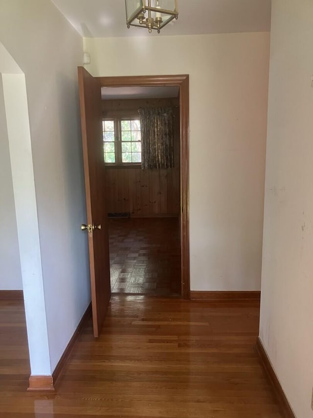 874 Evans Rd, Charleston, SC 29412 - hallway with wood finished floors and a chandelier