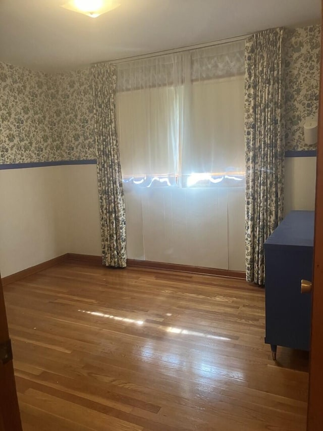 874 Evans Rd, Charleston, SC 29412 - unfurnished room featuring wallpapered walls and hardwood / wood-style flooring