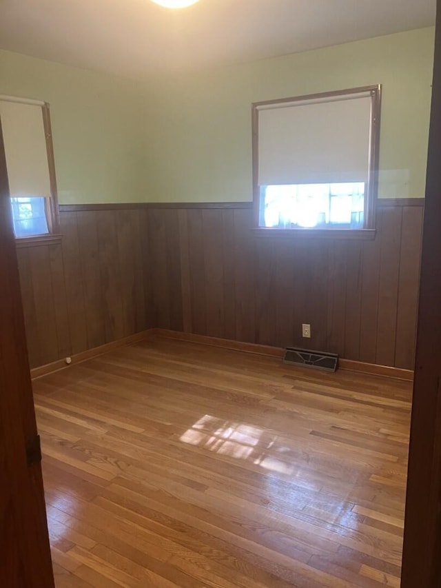 874 Evans Rd, Charleston, SC 29412 - spare room featuring a wainscoted wall and wood-type flooring